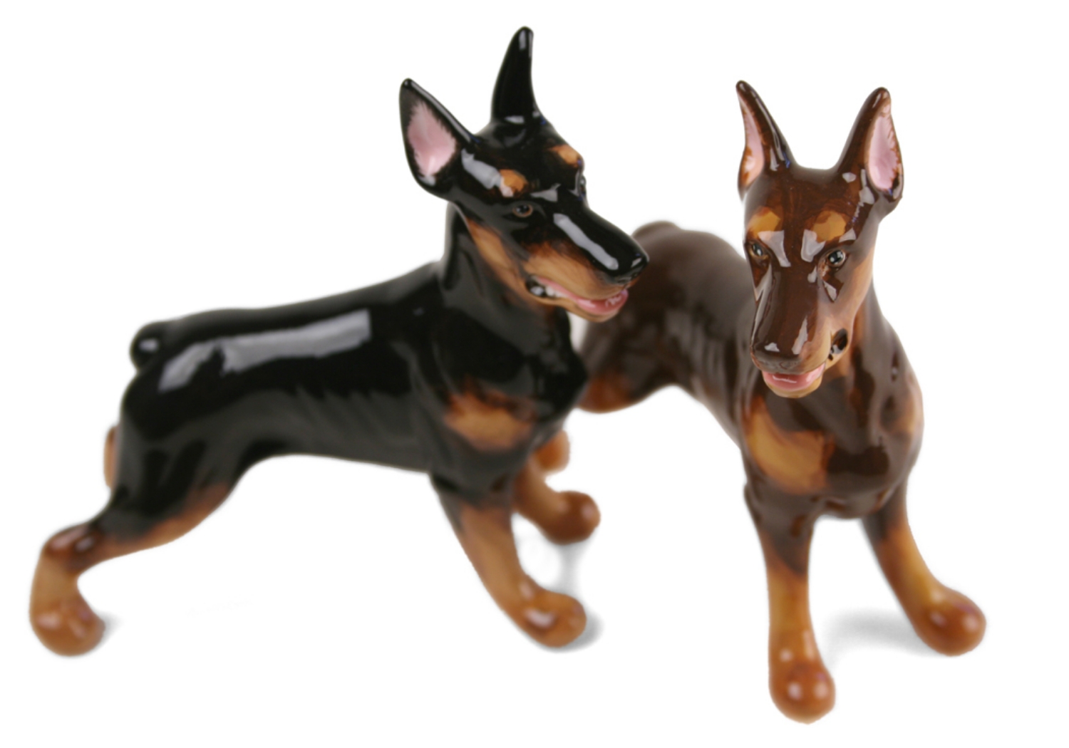 A beautiful handmade Blue Witch ceramic featuring the sleek and elegant Doberman. This fearless animal is renowned for its prowess as a guard dog.