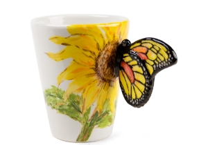 A beautiful ethereal Butterfly resting on a gorgeous Blue Witch ceramic coffee mug. Butterflies are fascinating creatures, with its humble beginnings as the caterpillar to its truly astonishing metamorphosis into the airborne butterfly.