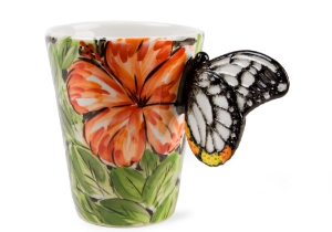 A beautiful ethereal Butterfly resting on a gorgeous Blue Witch ceramic coffee mug. Butterflies are fascinating creatures, with its humble beginnings as the caterpillar to its truly astonishing metamorphosis into the airborne butterfly.