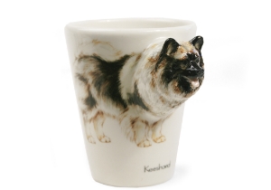 A wonderful Blue Witch ceramic. The Keeshond originated in Germany and its closest relatives are other German spitzes such as the Pomeranian. They are quick learners and eager to please. Many Keeshonds have been successfully trained to serve as guide dogs for the blind.