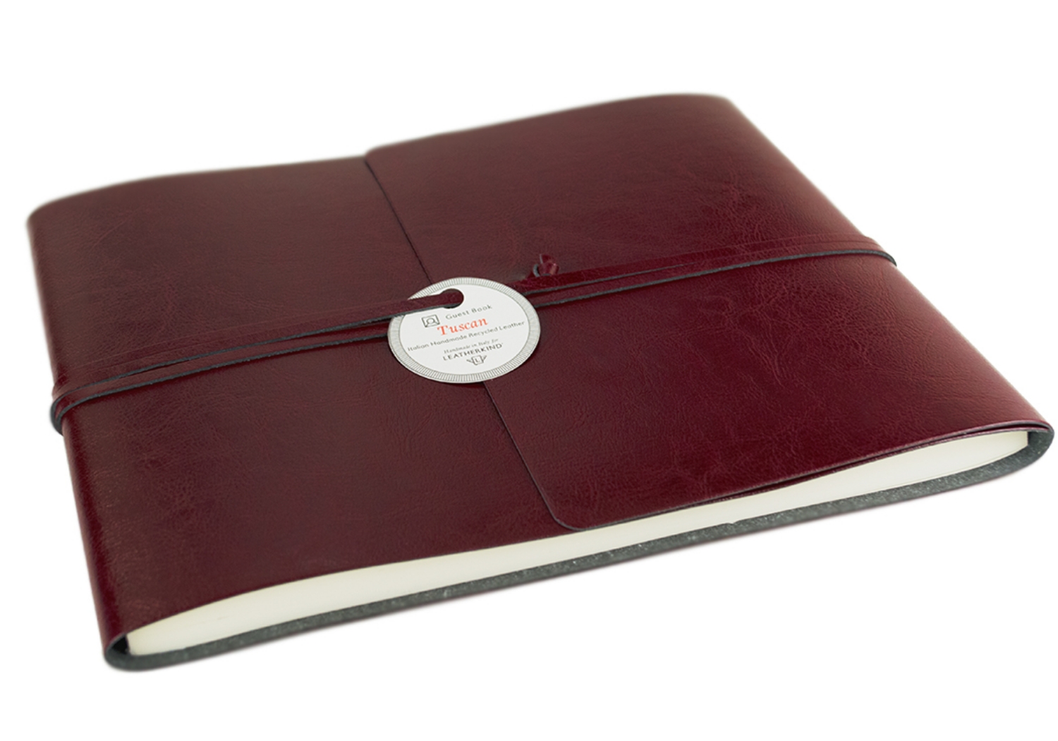 Representative of Tuscany in all its glory. The passion and skill of our Italian master craftsmen are utilised to produce the Tuscan collection, an environmentally friendly option which is still a fun yet glamorous choice. Specially developed by Italian expertise for LEATHERKIND ® Handmade in Florence using a new innovative technology: this natural recycled leather Guest Book has a smooth glossy finish which still allows for flexibility. A range of tasteful colours has been carefully selected; chocolate, burgundy, sky blue, black and red. These shade express are evocative of strength whilst remaining cheerful to look at. The envelope wrap style delivers an enduring, handsome look.