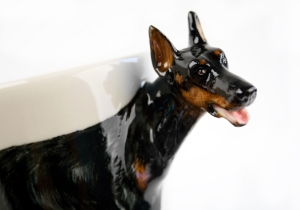 A beautiful handmade Blue Witch ceramic featuring the sleek and elegant Doberman. This fearless animal is renowned for its prowess as a guard dog.