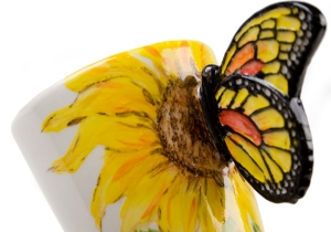 A beautiful ethereal Butterfly resting on a gorgeous Blue Witch ceramic coffee mug. Butterflies are fascinating creatures, with its humble beginnings as the caterpillar to its truly astonishing metamorphosis into the airborne butterfly.