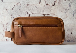 Rugged and refined. Designed for all your grooming needs with a spacious interior for all your toiletry essentials. The Wilson men's leather toiletry wash bag is handcrafted from high-quality calf leather. Tough, durable and water-resistant. It's got the room but is still compact enough to fit into any bag or suitcase.