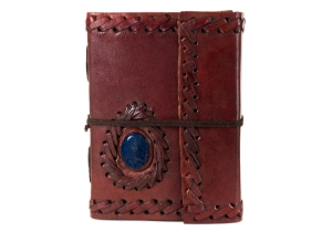 Leather and stone are a magic combination, made durable by nature and authentic by our design. Our Ra collection of leather journals features a stone motif to create an energetic and visible impact. The Lapis Lazuli is the eye of inner power and represents wisdom and enlightenment of the mind. This carefully selected, midnight blue semi-precious stone is aesthetically embedded in rugged, yet soft and supple buffalo hide. Beautifully contoured with hand stitched leather cord around the stone and journal to create a dimensional frame and intrepid feel. The exposed spine binding is pure leather cord which has been hand sewn to hold the pages in place and will certainly stand the test of the time.