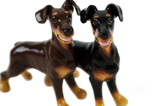 A beautiful handmade Blue Witch ceramic featuring the sleek and elegant Doberman. This fearless animal is renowned for its prowess as a guard dog.
