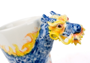 A singularly influential and benevolent symbol in Chinese culture signifying greatness and goodness. The power of this legend has been visually infused into our dynamic Dragon Coffee Mug.A commanding design combined with intensely hand embossed tree bark until it forms a three-dimensional embodiment of an almighty Dragon. Natural ash colour dye used to embrace its power.  A powerful setting and perfectly placed for blessings in Chinese Feng Shui.