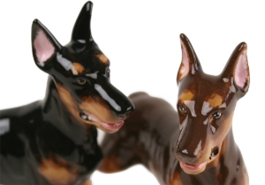 A beautiful handmade Blue Witch ceramic featuring the sleek and elegant Doberman. This fearless animal is renowned for its prowess as a guard dog.