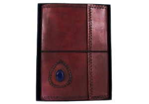 Leather and stone are a magic combination, made durable by nature and authentic by our design. Our Ra collection of leather journals features a stone motif to create an energetic and visible impact. The Lapis Lazuli is the eye of inner power and represents wisdom and enlightenment of the mind. This carefully selected, midnight blue semi-precious stone is aesthetically embedded in rugged, yet soft and supple buffalo hide. Beautifully contoured with hand stitched leather cord around the stone and journal to create a dimensional frame and intrepid feel. The exposed spine binding is pure leather cord which has been hand sewn to hold the pages in place and will certainly stand the test of the time.