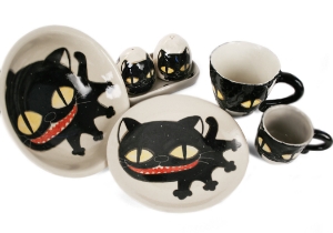 An eye catching feline takes the starring role on our Blue Witch Coraline ceramic collection.Each Bowl is ingeniously hand illustrated by a prolific artist. The canny brush strokes and cunning design create a curiosity with an air of mystery. Each piece is hand tooled to form a slightly eccentric asymmetrical shape. Visually and audibly theatrical whilst great for everyday use, dishwasher safe and microwave friendly to guarantee the colour will never fade.  It will also add a magical charm to a dinner party. Guaranteed to make the kids ‘Meow’ with delight and full of joie de vivre at any fun theme party!